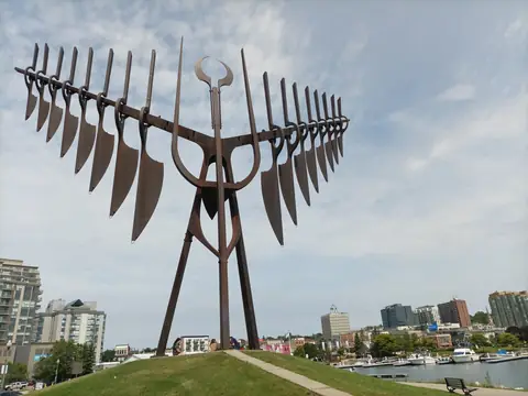 Spirit Catcher sculpture on the Barrie waterfront with downtown behind